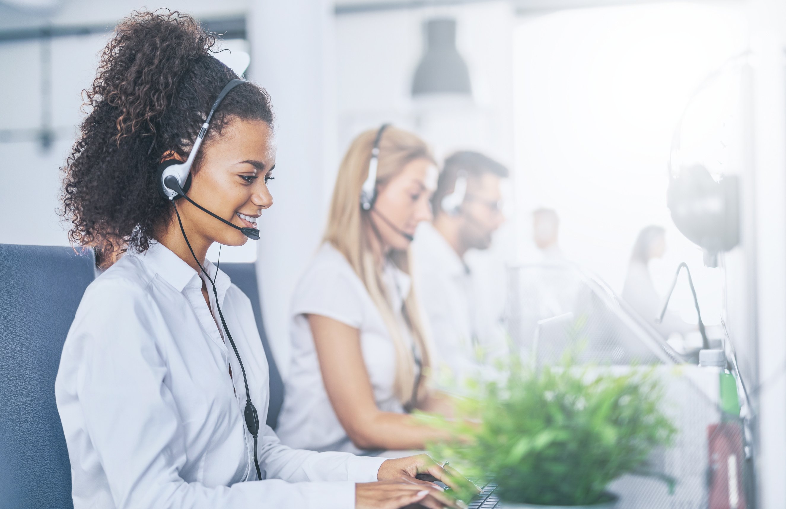 Call Center Worker Accompanied by Her Team.